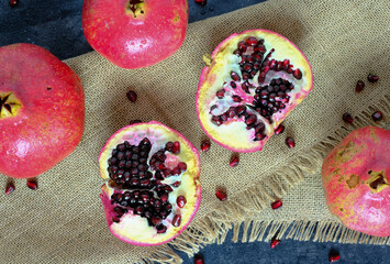 Top view of red ripe pomegranates on brown napkin. High quality photo