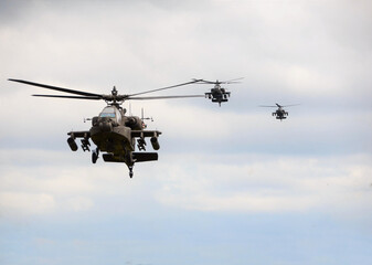 Naklejka na ściany i meble military combat helicopters in the air