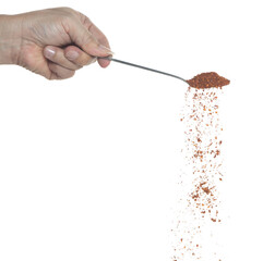 Red Hot Chilli fall, red grain chilli explode abstract cloud fly from silver spoon. Beautiful complete seed chilly, food object design. Selective focus freeze shot white background isolated