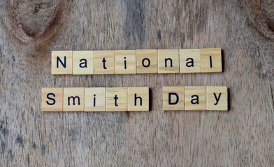 National Smith Day text on wooden square, holiday concept quotes