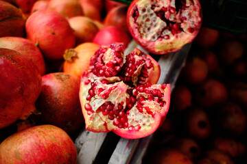 Pomegranate garnet fruit  background. Fresh organic garnets. Natural pomegranate heap closeup top...