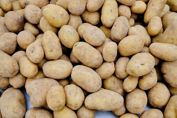 Fototapeta na wymiar a many potatoes in a pile