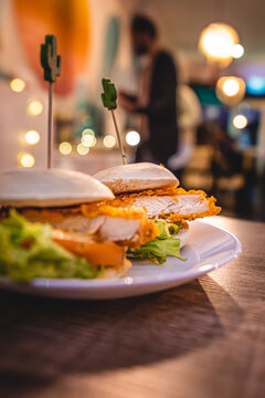 A plate of mini Mexican chicken burgers on the table