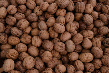 Close-up organic walnuts at the market.
Large pile of walnuts, on display at a local farmers market.