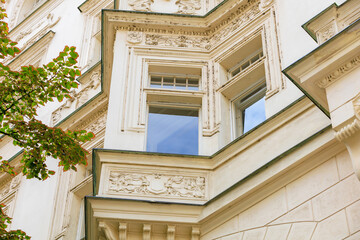 Corner of the house of classical European architecture of the old cozy tourist city. Background...