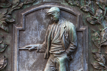 Ancient bas-reliefs in the architecture of the city. Historical and cultural heritage. Background with selective focus