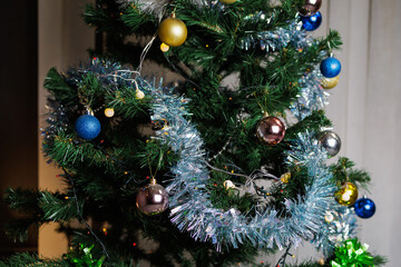 Christmas balls on the Christmas tree. Preparation for the holidays. Background with selective focus