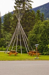 teepee poles and picnic tables. © rlesyk