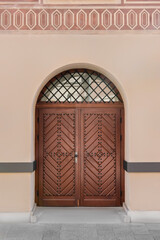 Entrance of building with brown wooden door