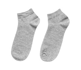 Pair of grey socks on white background, top view