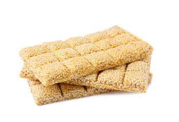 Tasty sesame kozinaki bars on white background
