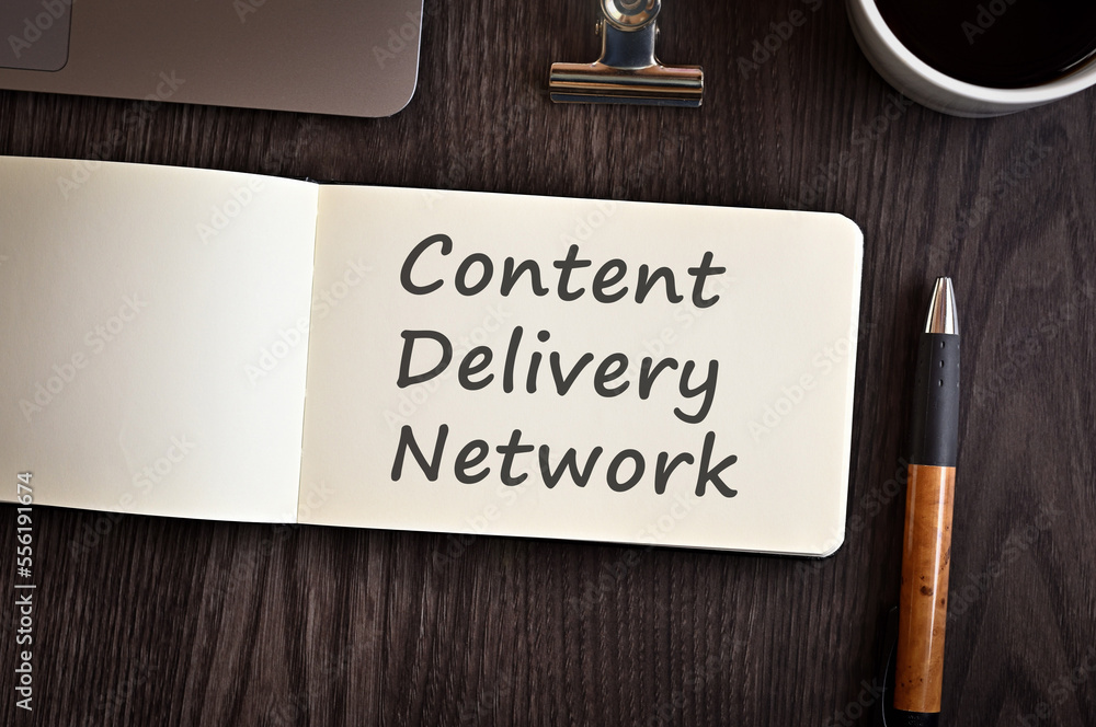 Poster there is notebook with the word content delivery network. it is an eye-catching image.