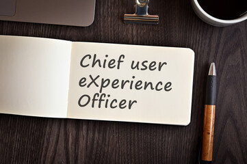 There is notebook with the word Chief user eXperience Officer. It is an eye-catching image.