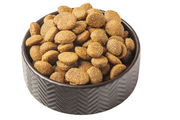 Dry pet food in a black bowl. Food is balanced for animals.