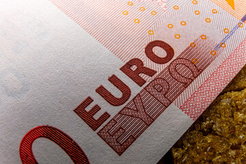close-up of a zero euro banknote is a macro. The banknote, part of European currency, is a symbol of current financial crisis and recession affected many countries and economies. - 556192616