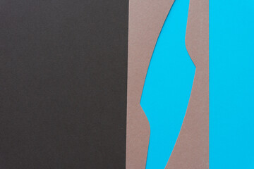 abstract shape with solid brown and blue paper backdrop