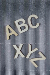 abc and xyz on silver corrugated paper