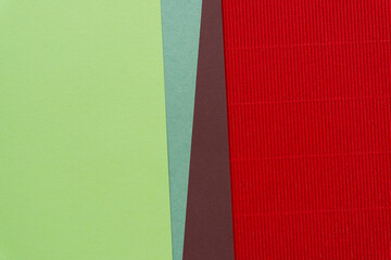 smooth green and brown paper (with triangle elements) and red corrugated paper