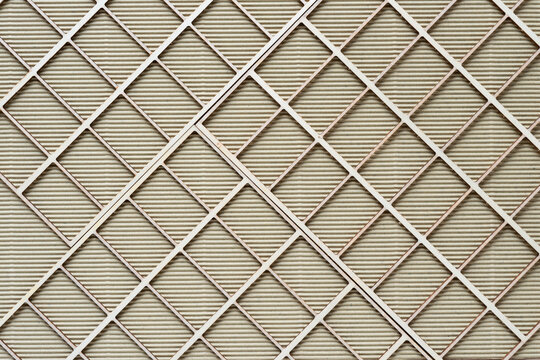 abstract background with wooden lattice or grid on beige corrugated paper