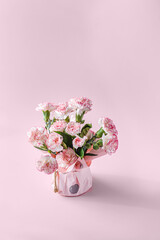 bouquet of flowers on a pink background