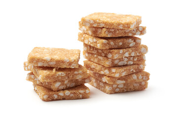 coconut biscuits, textured crispy square shaped homemade cookies isolated on white background, selective focus