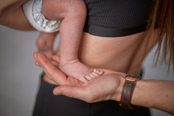 Baby feet in father hands. Tiny Newborn Baby feet on male close up. Dad and he Child. Happy Family concept. Beautiful conceptual image of family.