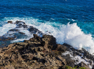 Fototapeta na wymiar Large Waves Washing Over The Olivine Pools, Maui, Hawaii, USA