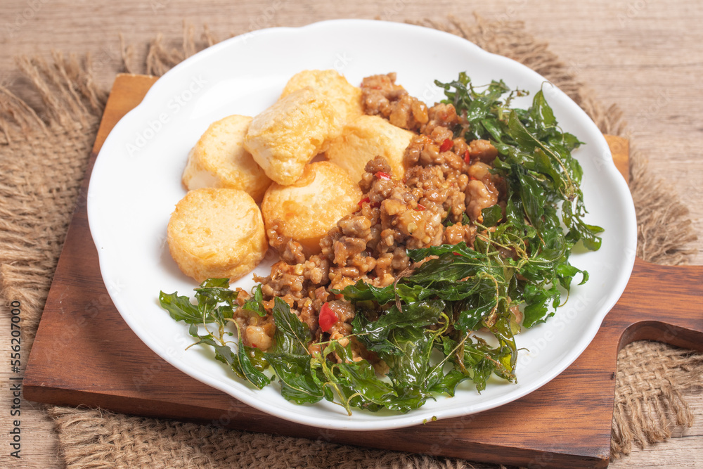 Poster stir fried egg tofu with pork basil