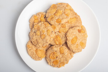 Cornflakes cookies on a white plate.Snack