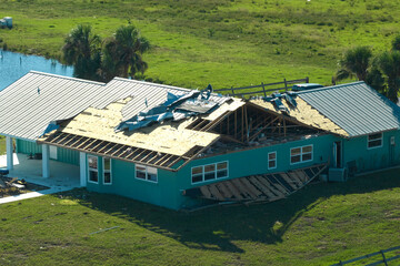 Hurricane Ian destroyed house in Florida residential area. Natural disaster and its consequences