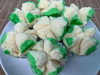 bolu kukus is an Indonesian traditional snack of steamed sponge cupcake - obrazy, fototapety, plakaty