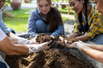 Happiness children study learning to prepare the soil before planting vegetables.