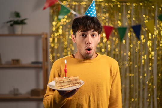 Shocked arabic man looking at camera with widely opened mouth, coming to party with cake to friend home, he forgot to take present. People, facial expressions, surprisment