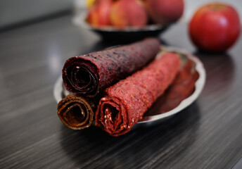 Homemade summer fruit pastille. Sweet vegetarian dessert.
Pastille rolls. Fruit leather in slices . Raw food, vegan sweetness, dessert without sugar and flour. For text and articles on health