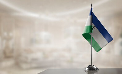 A small Lesotho flag on an abstract blurry background