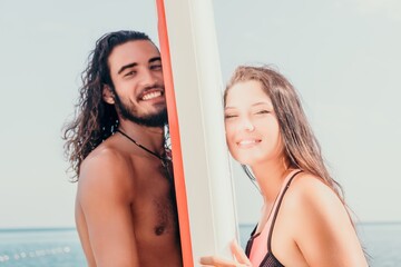 Woman man sea sup. Close up portrait of beautiful young caucasian woman with black hair and...