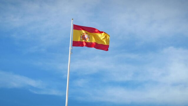 Spanish flag waving in wind. National flag of Spain waving on flagpole