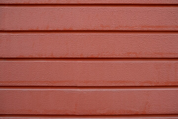 photo of the red wall of the house with horizontal stripes
 brick color background