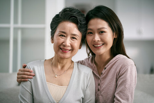 portrait of asian senior mother and adult daughter