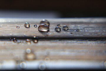 Close up of water drops on impregnated wooden surface