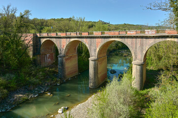 Old stone transport bridge in Tuscan countryside