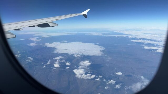 View from window of airplane flying over Spain in December