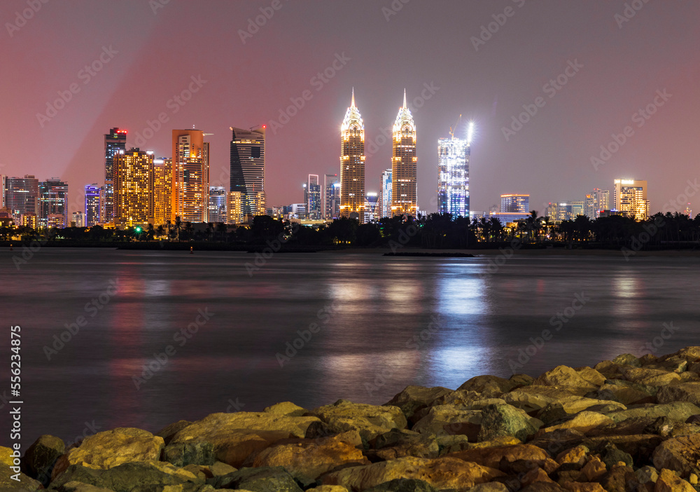 Wall mural dubai, uae - 11.05.2022 - shot of a night cityscape. urban