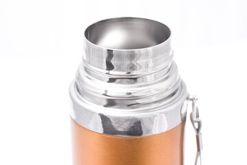 open neck of a orange thermos on a white background