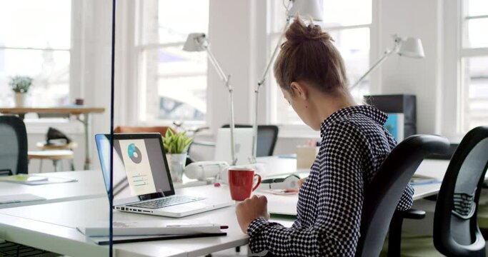 Woman, laptop and office of creative business startup in digital advertising, design and marketing company. Businesswoman planning, SEO software strategy and ux web design employee working at desk