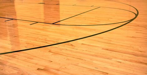 Interior of empty modern basketball indoor sport court, semigloss coating wooden floor, artificial...