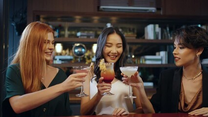 4K Group of Attractive woman enjoy and fun hangout nightlife meeting and drinking fancy cocktail together at luxury restaurant bar. Happy female friends celebrating holiday event party at nightclub.