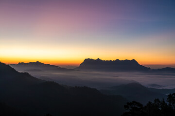 Obraz premium Majestic view of Doi Luang Chiang Dao in northern Thailand, the third highest mountain in Thailand, seen with beautiful dramatic clouds and colorful sky