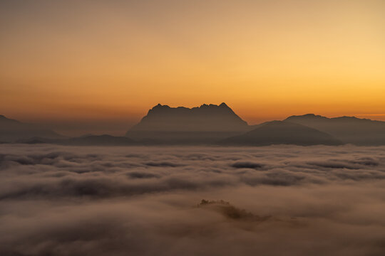 Majestic view of Doi Luang Chiang Dao in northern Thailand, the third highest mountain in Thailand, seen with beautiful dramatic clouds and colorful sky © kudosstudio