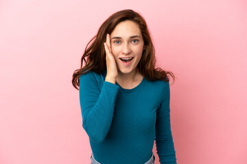 Young caucasian woman isolated on pink background with surprise and shocked facial expression